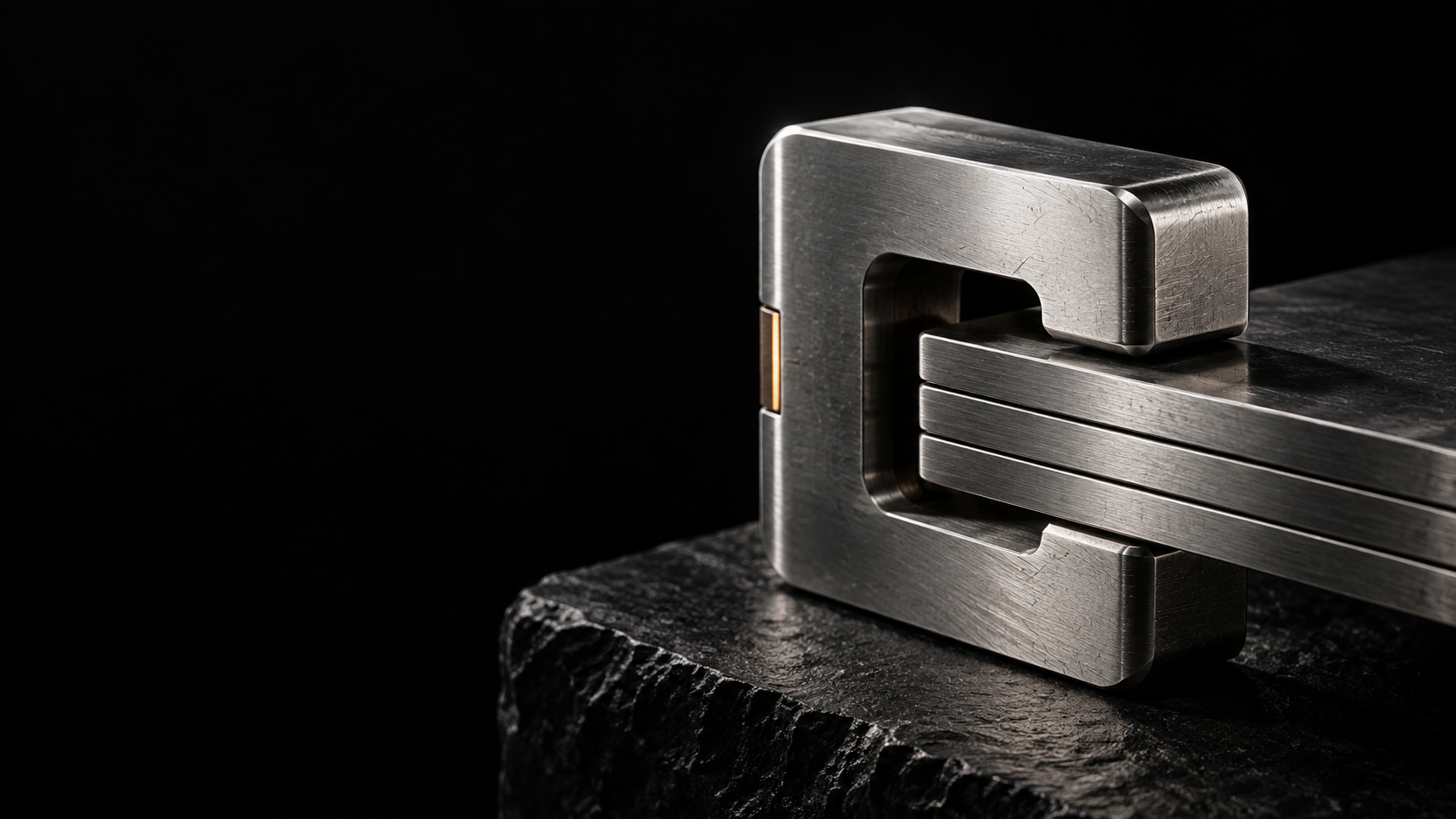 A machined silver clasp holding three evidence plates, with a fine amber seam